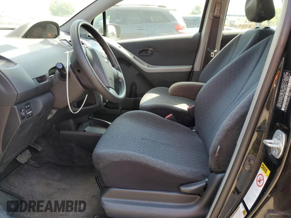 2009 Toyota Yaris with VIN JTDKT903795233081, listed as a Copart auction lot 56407165 with 172,631 mi miles and Clean Title. Bid and sale history available at DreamBid. Image 7.