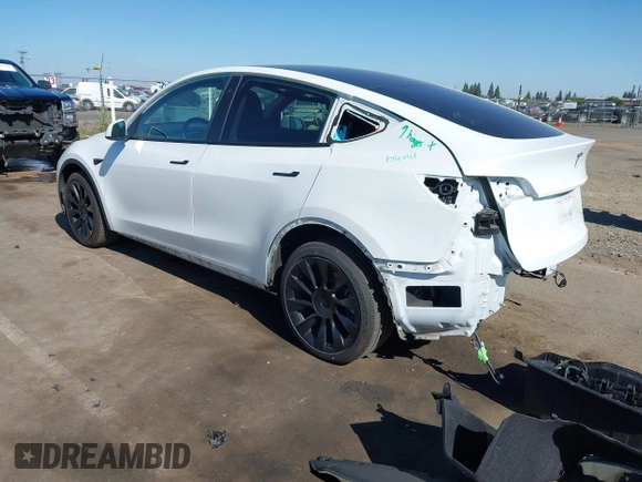 2022 Tesla Model Y Long Range with VIN 7SAYGDEE1NF364241, listed as a IAAI auction lot 42190272 with 54,878 mi miles and . Bid and sale history available at DreamBid. Image 3.