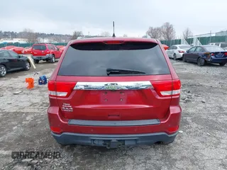 2012 Jeep Grand Cherokee Laredo with VIN 1C4RJFAG7CC221682, listed as a IAAI auction lot 41881922 with 218,762 mi miles. Bid and sale history available at carsss.com. Image 16.