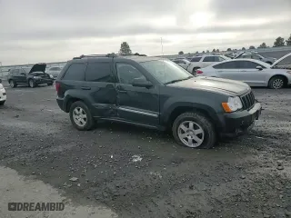2010 Jeep Grand Cherokee Laredo with VIN 1J4RR4GT7AC120604, listed as a Copart auction lot 84257724 with 60,827 mi miles and Salvage Title. Bid and sale history available at carsss.com. Image 11.