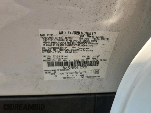 2013 Ford Taurus Limited with VIN 1FAHP2F88DG102737, listed as a Copart auction lot 63327915 with 87,009 mi miles and Salvage title. Bid and sale history available at DreamBid. Image 12.