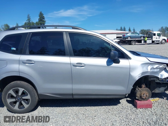 2018 Subaru Forester with VIN JF2SJABC1JH460789, listed as a IAAI auction lot 42631854 with 86,215 mi miles and . Bid and sale history available at DreamBid. Image 14.