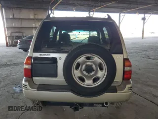 1999 Suzuki Grand Vitara LX z VIN JS3TD62V3X4123048, wystawiony jako Copart lot #73007124 z przebiegiem 159 828 mil mil oraz Szkoda całkowita • Salvage title. Historia ofert i sprzedaży dostępna na DreamBid. Obrazek 6.