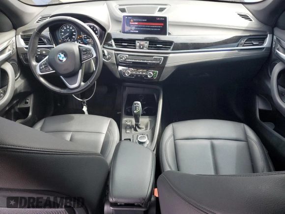2021 BMW X1 xDrive28i with VIN WBXJG9C0XM5U47141, listed as a Copart auction lot 60645865 with 56,106 mi miles and Salvage title. Bid and sale history available at DreamBid. Image 8.
