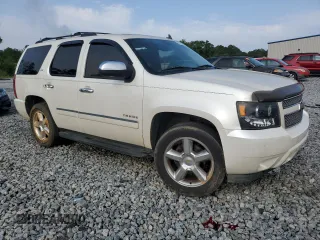 2011 Chevrolet Tahoe LTZ with VIN 1GNSCCE06BR346909, listed as a Copart auction lot 57366535 with 283,935 mi miles and Salvage title. Bid and sale history available at DreamBid. Image 4.
