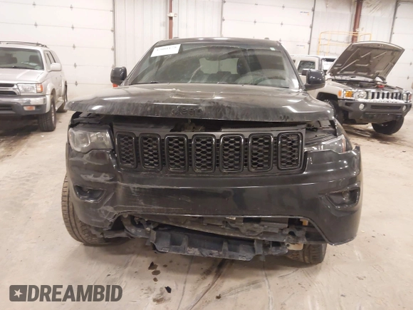 2018 Jeep Grand Cherokee Laredo E with VIN 1C4RJFAG5JC417701, listed as a IAAI auction lot 42001159 with 110,767 mi miles and . Bid and sale history available at DreamBid. Image 6.