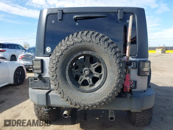 2014 Jeep Wrangler Sport with VIN 1C4AJWAG5EL206565, listed as a IAAI auction lot 42015000 with 90,129 mi miles and . Bid and sale history available at carsss.com. Image 16.