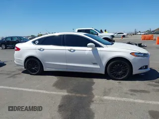 2016 Ford Fusion Titanium z VIN 3FA6P0SU2GR357508, wystawiony jako IAAI lot #42551834 z przebiegiem 177 425 mil mil oraz . Historia ofert i sprzedaży dostępna na DreamBid. Obrazek 13.