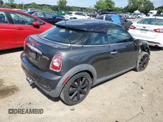 2015 MINI Coupe S z VIN WMWSX3C55FT409449, wystawiony jako Copart lot #66574174 z przebiegiem 99 155 mil mil oraz Szkody całkowita. Historia ofert i sprzedaży dostępna na DreamBid. Obrazek 3.