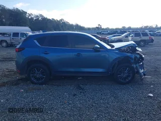 2020 Mazda CX-5 Touring with VIN JM3KFACM0L0775020, listed as a IAAI auction lot 40876970 with 96,424 mi miles. Bid and sale history available at carsss.com. Image 12.