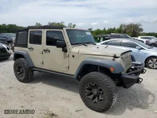2017 Jeep Wrangler Unlimited Sport with VIN 1C4BJWDG5HL670282, listed as a Copart auction lot 52332905 with 106,022 mi miles and Salvage Title. Bid and sale history available at carsss.com. Image 4.