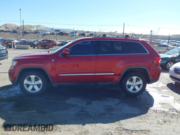 2011 Jeep Grand Cherokee 70th Anniversary with VIN 1J4RR4GT2BC703163, listed as a IAAI auction lot 41763149 with 184,523 mi miles. Bid and sale history available at carsss.com. Image 14.