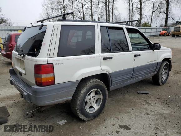1997 Jeep Grand Cherokee Laredo with VIN 1J4GZ58SXVC597519, listed as a Copart auction lot 88437475 with 172,051 mi miles and Salvage Title. Bid and sale history available at carsss.com. Image 3.