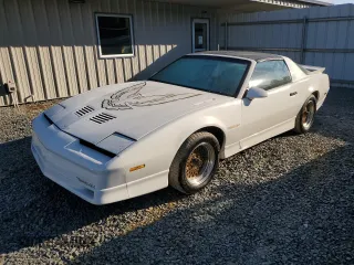 1988 Pontiac Firebird z VIN 1G2FW2183JL204840, wystawiony jako Copart lot #69142254 z przebiegiem 62 529 mil mil oraz Czysty tytuł • Clean title. Historia ofert i sprzedaży dostępna na DreamBid. Obrazek 1.
