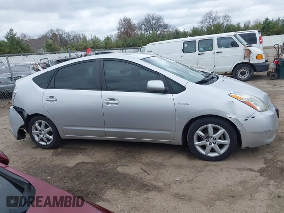 2007 Toyota Prius z VIN JTDKB20U977666406, wystawiony jako IAAI lot #42081233 z przebiegiem Nie podano mil oraz . Historia ofert i sprzedaży dostępna na DreamBid. Obrazek 13.