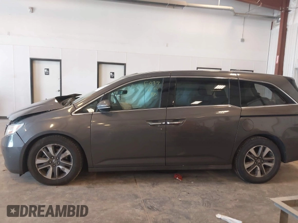 2014 Honda Odyssey Touring with VIN 5FNRL5H99EB105059, listed as a IAAI auction lot 42457672 with 240,581 mi miles and . Bid and sale history available at DreamBid. Image 14.