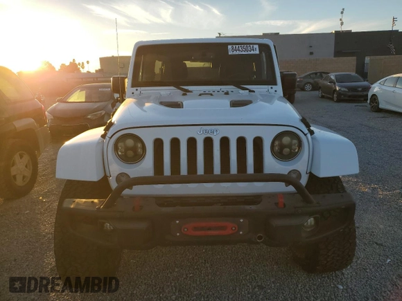 2015 Jeep Wrangler Unlimited Rubicon with VIN 1C4BJWFG5FL659017, listed as a Copart auction lot 84435034 with 69,915 mi miles and Salvage Title. Bid and sale history available at carsss.com. Image 5.