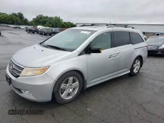2011 Honda Odyssey Touring with VIN 5FNRL5H99BB021223, listed as a Copart auction lot 61171775 with 194,029 mi miles and Salvage title. Bid and sale history available at DreamBid. Image 1.