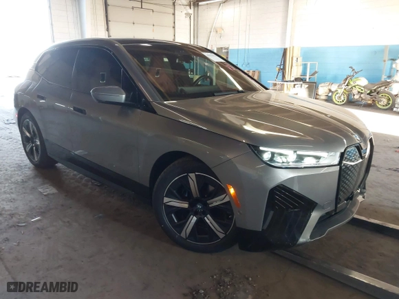 2023 BMW iX xDrive50 with VIN WB523CF08PCM10011, listed as a IAAI auction lot 41332976 with 19,013 mi miles. Bid and sale history available at carsss.com. Image 1.