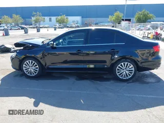 2015 Volkswagen Jetta Sedan 1.8T SE w/Connectivity with VIN 3VWD07AJ6FM354397, listed as a IAAI auction lot 41772983 with 100,265 mi miles. Bid and sale history available at carsss.com. Image 14.