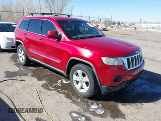 2011 Jeep Grand Cherokee 70th Anniversary with VIN 1J4RR4GT2BC703163, listed as a IAAI auction lot 41763149 with 184,523 mi miles. Bid and sale history available at carsss.com. Image 1.