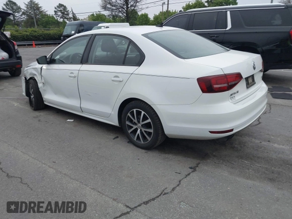 2016 Volkswagen Jetta Sedan 1.4T SE with VIN 3VWD67AJ6GM260584, listed as a IAAI auction lot 41903048 with 104,876 mi miles. Bid and sale history available at carsss.com. Image 3.