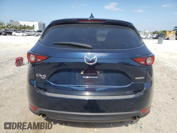 2021 Mazda CX-5 Grand Touring with VIN JM3KFBDM4M1462570, listed as a Copart auction lot 54827675 with 45,389 mi miles and Salvage Title. Bid and sale history available at DreamBid. Image 6.