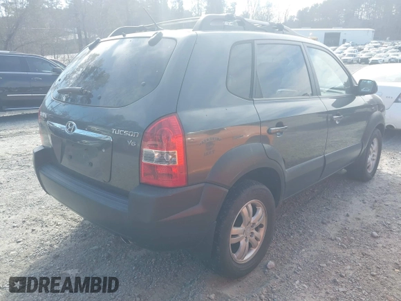 2007 Hyundai Tucson SE with VIN KM8JN12DX7U635740, listed as a IAAI auction lot 41648027 with 169,967 mi miles. Bid and sale history available at carsss.com. Image 4.