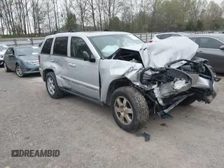 2009 Jeep Grand Cherokee Laredo with VIN 1J8GR48K09C557139, listed as a IAAI auction lot 41994604 with 1 mi miles. Bid and sale history available at carsss.com. Image 1.