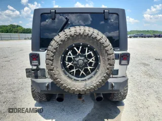 2007 Jeep Wrangler Unlimited Sahara с VIN 1J4GA59167L183198, выставлен на аукционе Copart как лот 62135995 с пробегом Не указан миль и Списание • Salvage title. История ставок и продаж доступна на DreamBid. Изображение 6.
