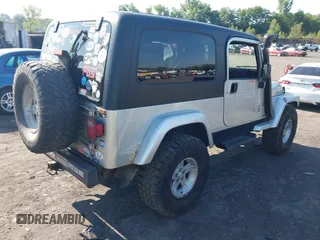 2005 Jeep Wrangler Unlimited with VIN 1J4FA44S55P352803, listed as a IAAI auction lot 42688284 with 128,586 mi miles and . Bid and sale history available at DreamBid. Image 4.