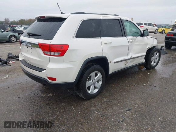 2012 Jeep Grand Cherokee Laredo with VIN 1C4RJFAG6CC297958, listed as a IAAI auction lot 40859811 with 213,499 mi miles. Bid and sale history available at carsss.com. Image 4.