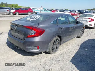 2019 Honda Civic Sport with VIN 2HGFC2F8XKH598141, listed as a IAAI auction lot 42013724 with 98,401 mi miles and . Bid and sale history available at DreamBid. Image 4.