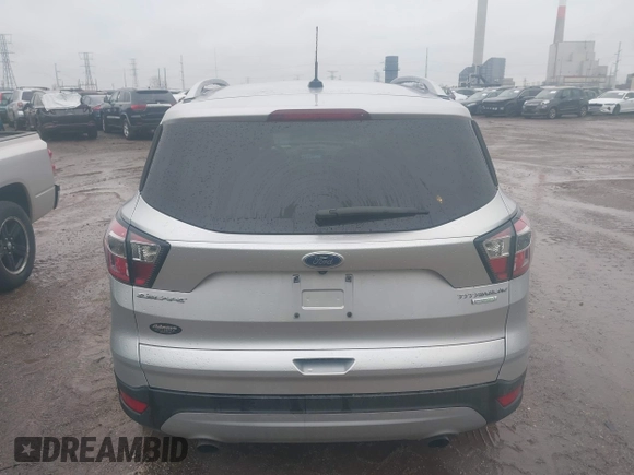2017 Ford Escape Titanium with VIN 1FMCU0J96HUC21987, listed as a IAAI auction lot 41971376 with 97,488 mi miles and . Bid and sale history available at DreamBid. Image 16.