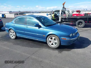 2002 Jaguar X-Type with VIN SAJEA51C42WC11103, listed as a IAAI auction lot 41699366 with 106,418 mi miles. Bid and sale history available at carsss.com. Image 1.