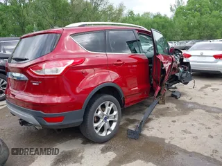 2016 Ford Escape Titanium with VIN 1FMCU9JX0GUA29353, listed as a IAAI auction lot 42133326 with 143,892 mi miles and . Bid and sale history available at DreamBid. Image 4.