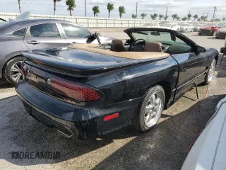 2001 Pontiac Firebird Trans Am z VIN 2G2FV32G812134704, wystawiony jako Copart lot #74893594 z przebiegiem Nie podano mil oraz Nie do naprawy • Non repairable. Historia ofert i sprzedaży dostępna na DreamBid. Obrazek 3.
