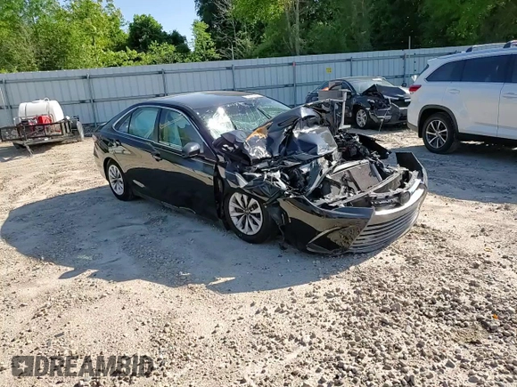 2017 Toyota Camry XLE z VIN 4T1BF1FK0HU700820, wystawiony jako Copart lot #52010655 z przebiegiem Nie podano mil oraz Szkoda całkowita • Salvage title. Historia ofert i sprzedaży dostępna na DreamBid. Obrazek 11.