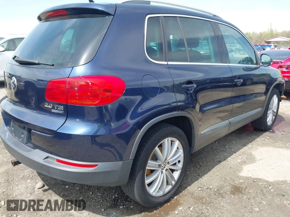 2012 Volkswagen Tiguan S with VIN WVGBV7AX3CW571039, listed as a IAAI auction lot 41928361 with 165,938 mi miles and . Bid and sale history available at DreamBid. Image 4.