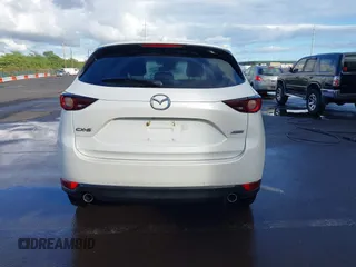 2018 Mazda CX-5 Touring with VIN JM3KFACM1J1431462, listed as a IAAI auction lot 41038099 with 77,489 mi miles. Bid and sale history available at carsss.com. Image 16.