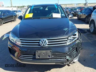 2016 Volkswagen Touareg Sport with VIN WVGEF9BP4GD012265, listed as a IAAI auction lot 41208383 with 69,205 mi miles and . Bid and sale history available at DreamBid. Image 12.