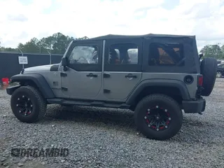 2014 Jeep Wrangler Unlimited Sport with VIN 1C4BJWDG3EL135351, listed as a IAAI auction lot 41947408 with 104,460 mi miles. Bid and sale history available at carsss.com. Image 14.