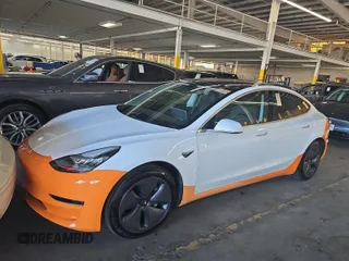 2020 Tesla Model 3 Long Range with VIN 5YJ3E1EB5LF790609, listed as a IAAI auction lot 42197431 with 14,853 mi miles and . Bid and sale history available at DreamBid. Image 1.