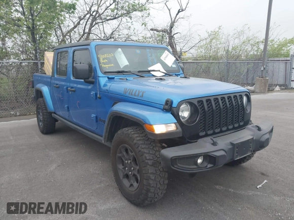 2023 Jeep Gladiator Sport S z VIN 1C6HJTAG6PL579136, wystawiony jako IAAI lot #41946641 z przebiegiem 14 856 mil mil oraz . Historia ofert i sprzedaży dostępna na DreamBid. Obrazek 1.