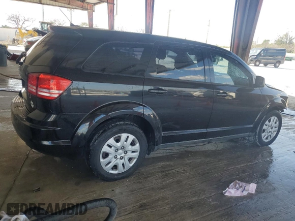 2013 Dodge Journey American Value with VIN 3C4PDCAB2DT684871, listed as a Copart auction lot 52288915 with 119,569 mi miles and Salvage title. Bid and sale history available at DreamBid. Image 3.