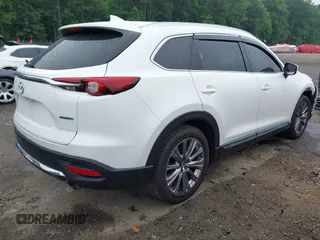 2021 Mazda CX-9 Signature with VIN JM3TCBEY4M0517118, listed as a IAAI auction lot 42400675 with 56,260 mi miles and . Bid and sale history available at DreamBid. Image 4.