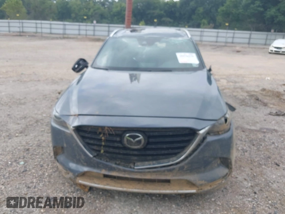 2021 Mazda CX-9 Grand Touring with VIN JM3TCADY2M0509286, listed as a IAAI auction lot 39976279 with 93,588 mi miles and . Bid and sale history available at DreamBid. Image 13.