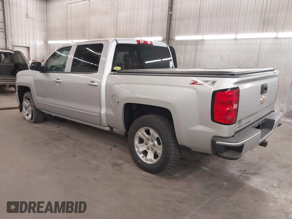 2017 Chevrolet Silverado 1500 LT with VIN 3GCUKREC5HG318772, listed as a IAAI auction lot 42056116 with 82,987 mi miles and . Bid and sale history available at DreamBid. Image 3.