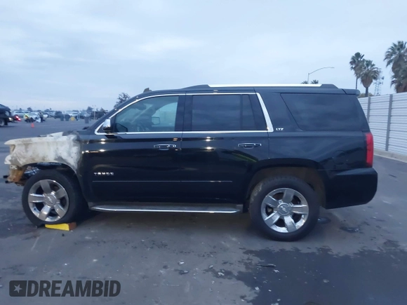 2015 Chevrolet Tahoe LTZ z VIN 1GNSKCKC5FR213209, wystawiony jako IAAI lot #41023368 z przebiegiem Nie podano mil oraz . Historia ofert i sprzedaży dostępna na DreamBid. Obrazek 13.