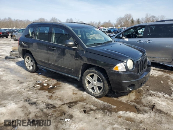 2010 Jeep Compass Sport with VIN 1J4NF4FB2AD591523, listed as a Copart auction lot 48809775 with 105,720 mi miles and Salvage Title. Bid and sale history available at carsss.com. Image 4.